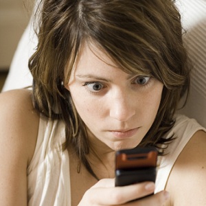 woman-staring-cell-phone